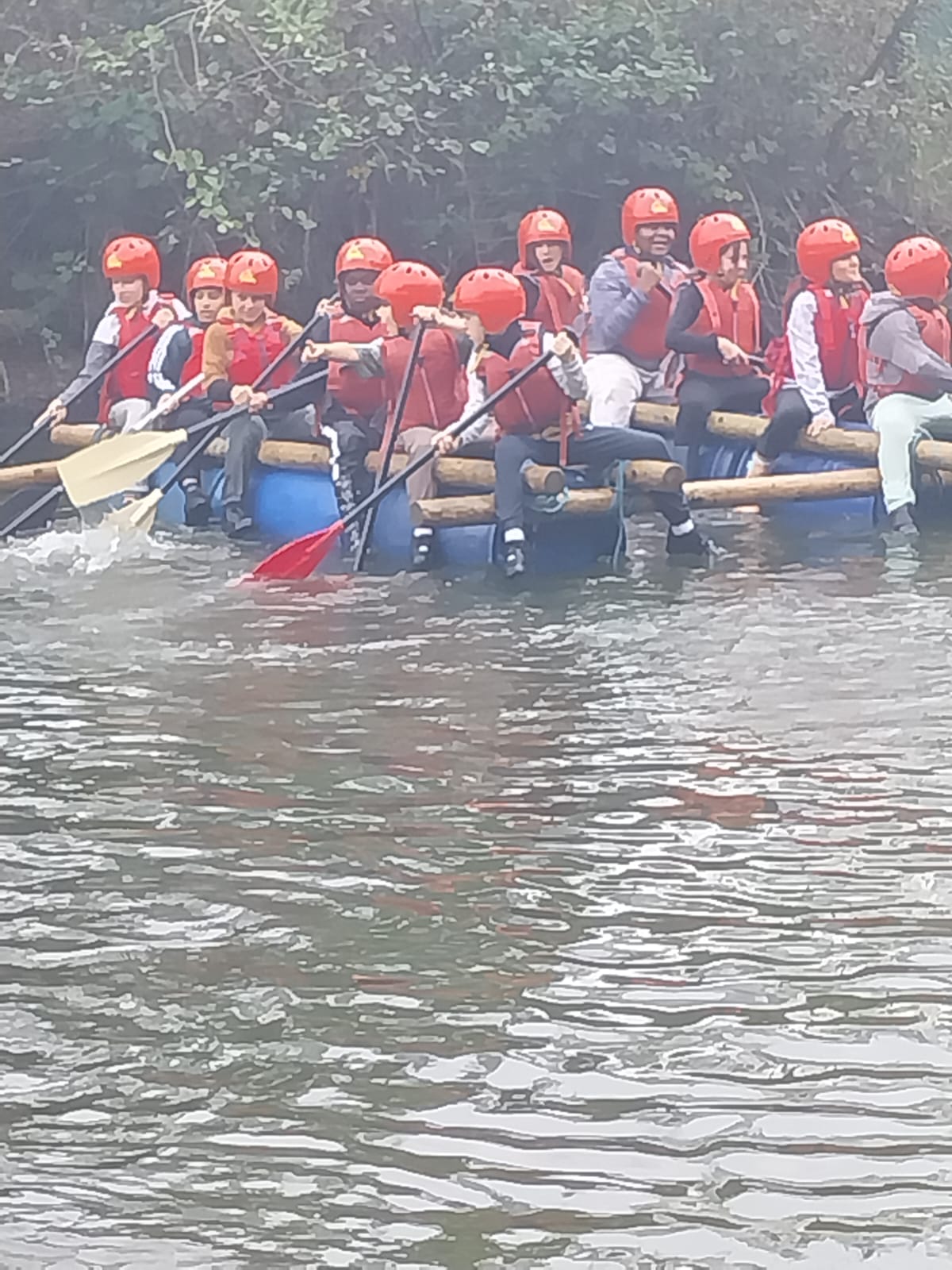 Some children on a raft in the water