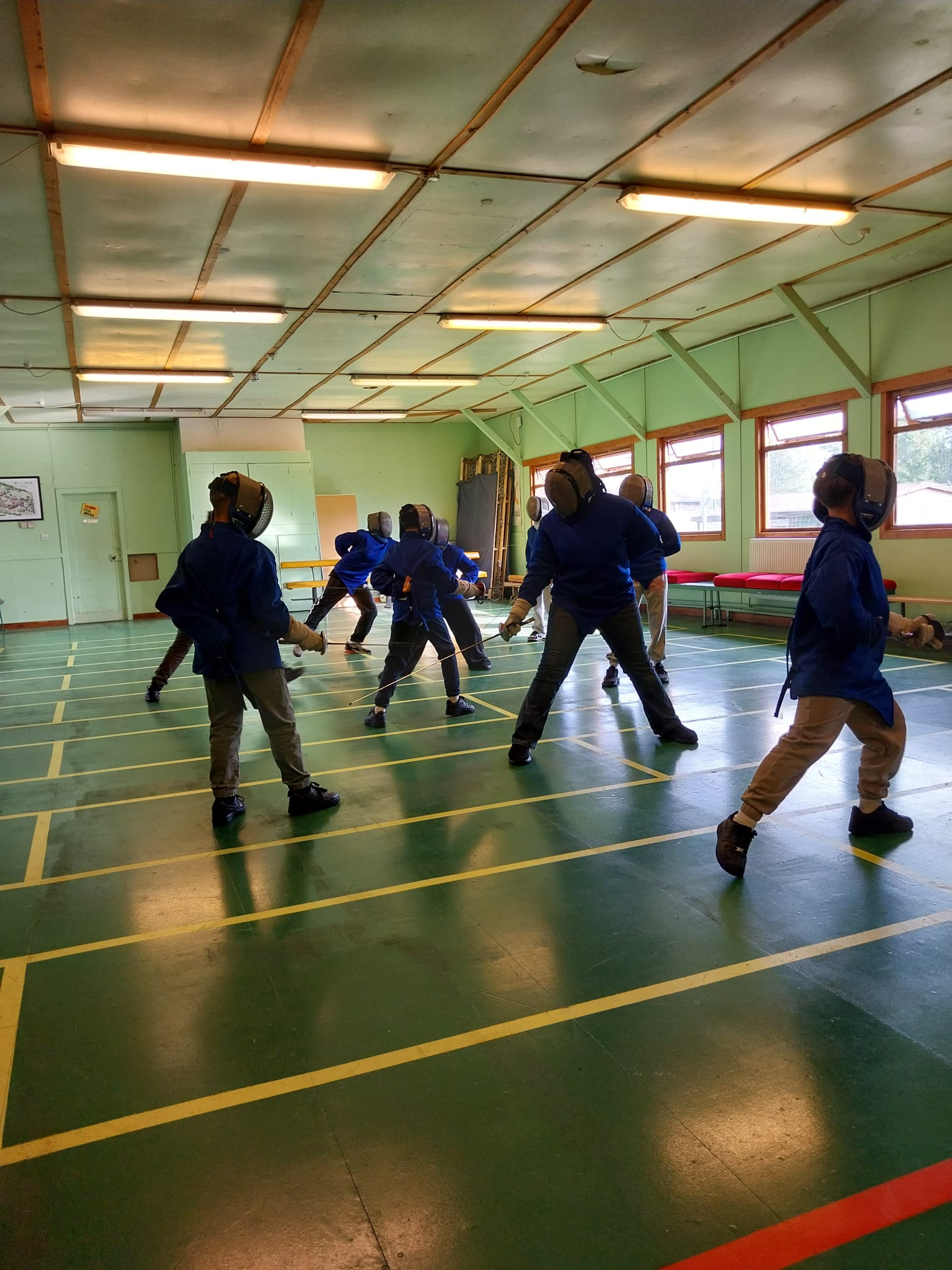 Group of children fencing