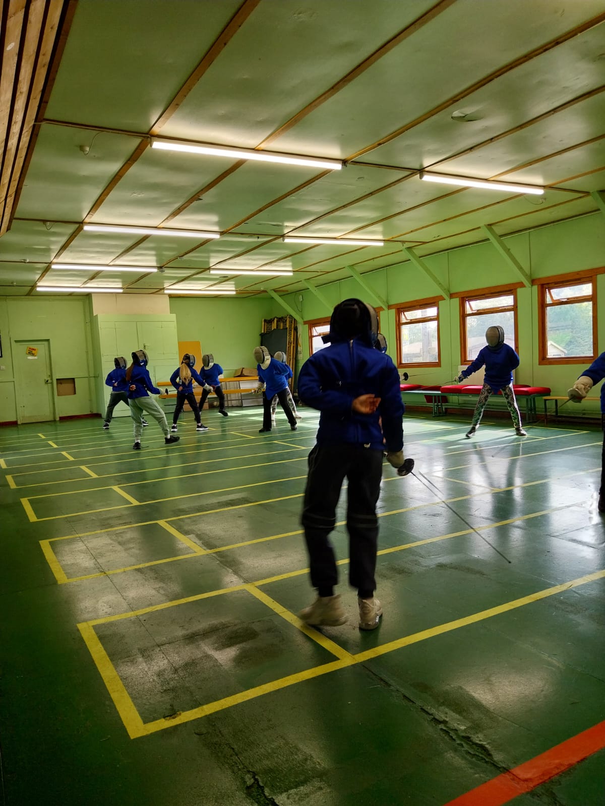 Group of children fencing