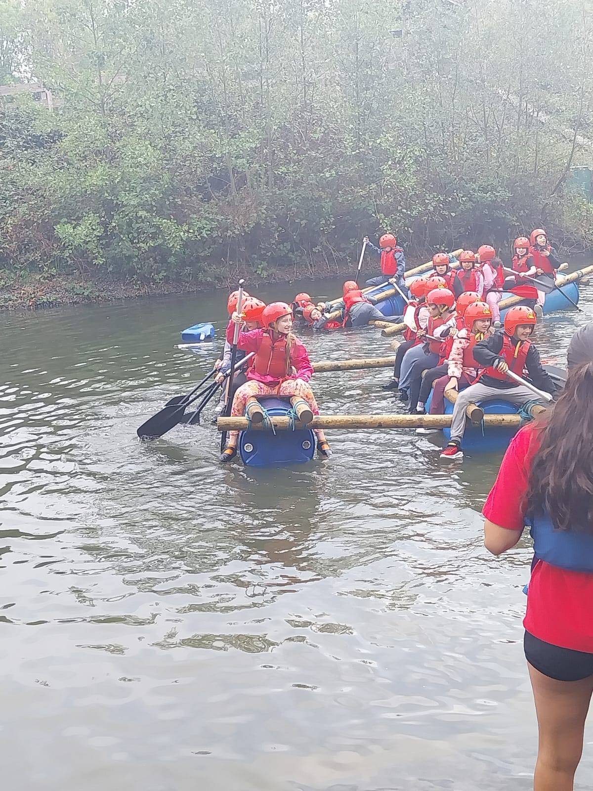 Some children on a raft in the water