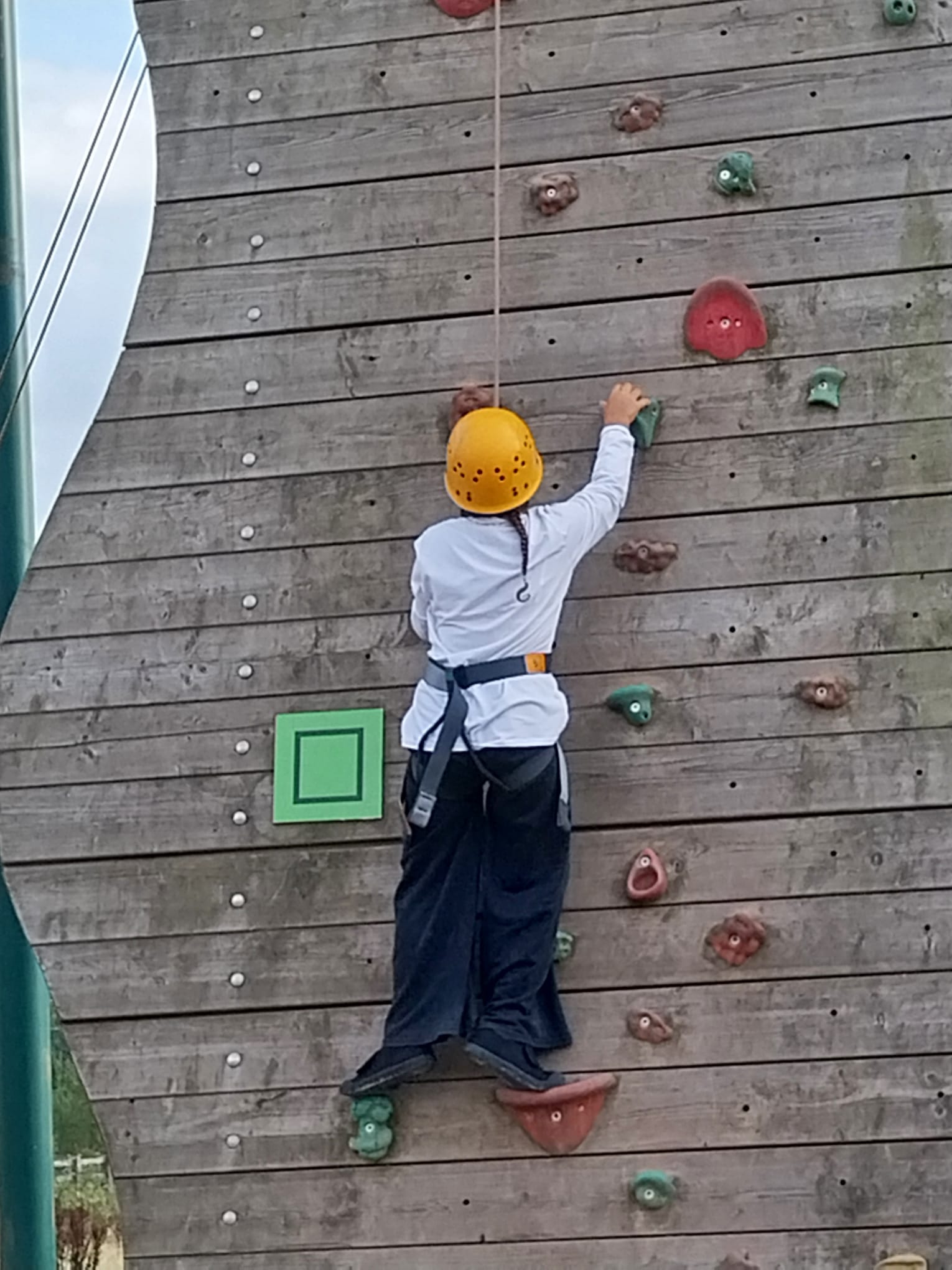 Girl on climbing wall