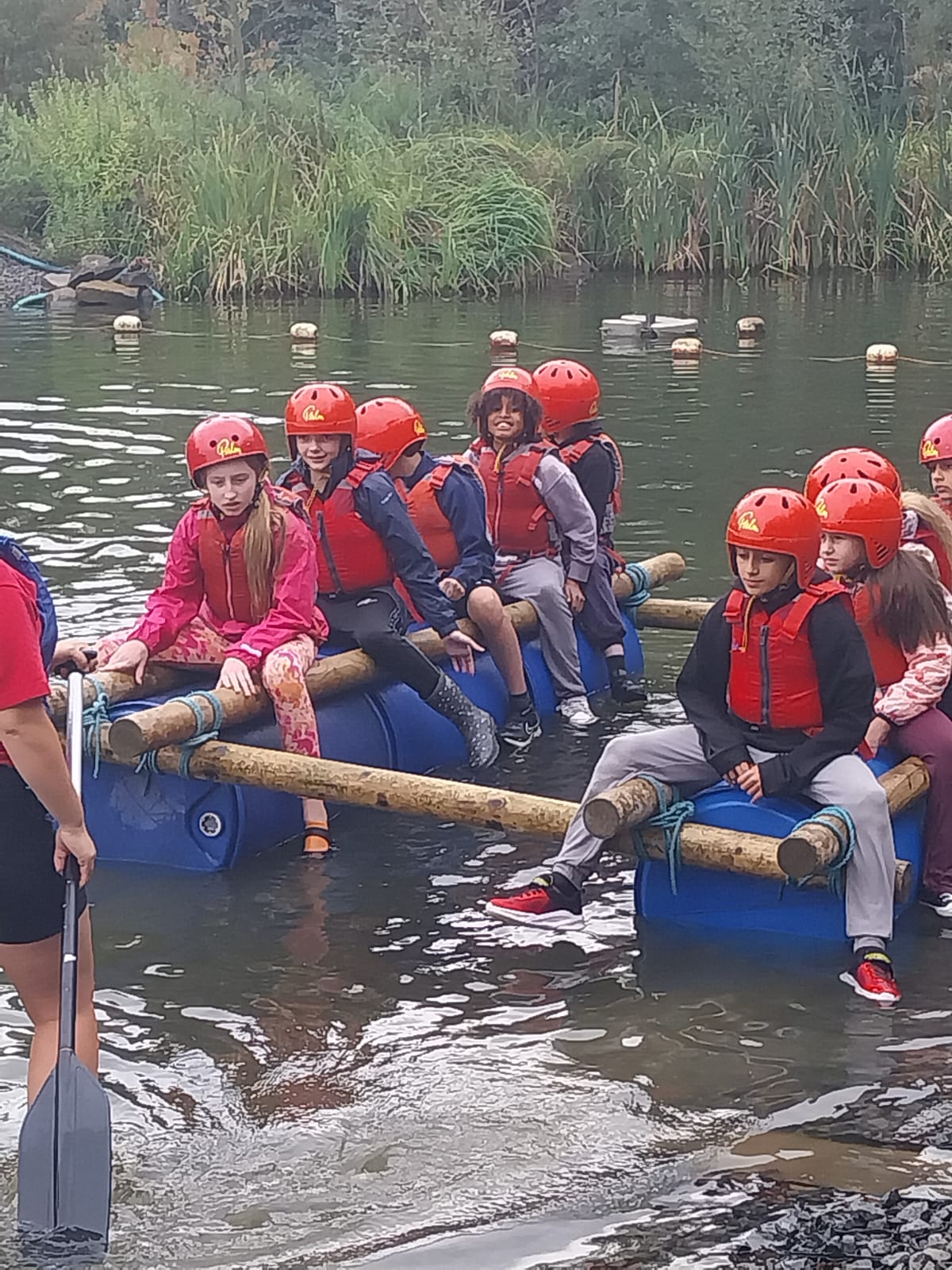 Some children on a raft in the water