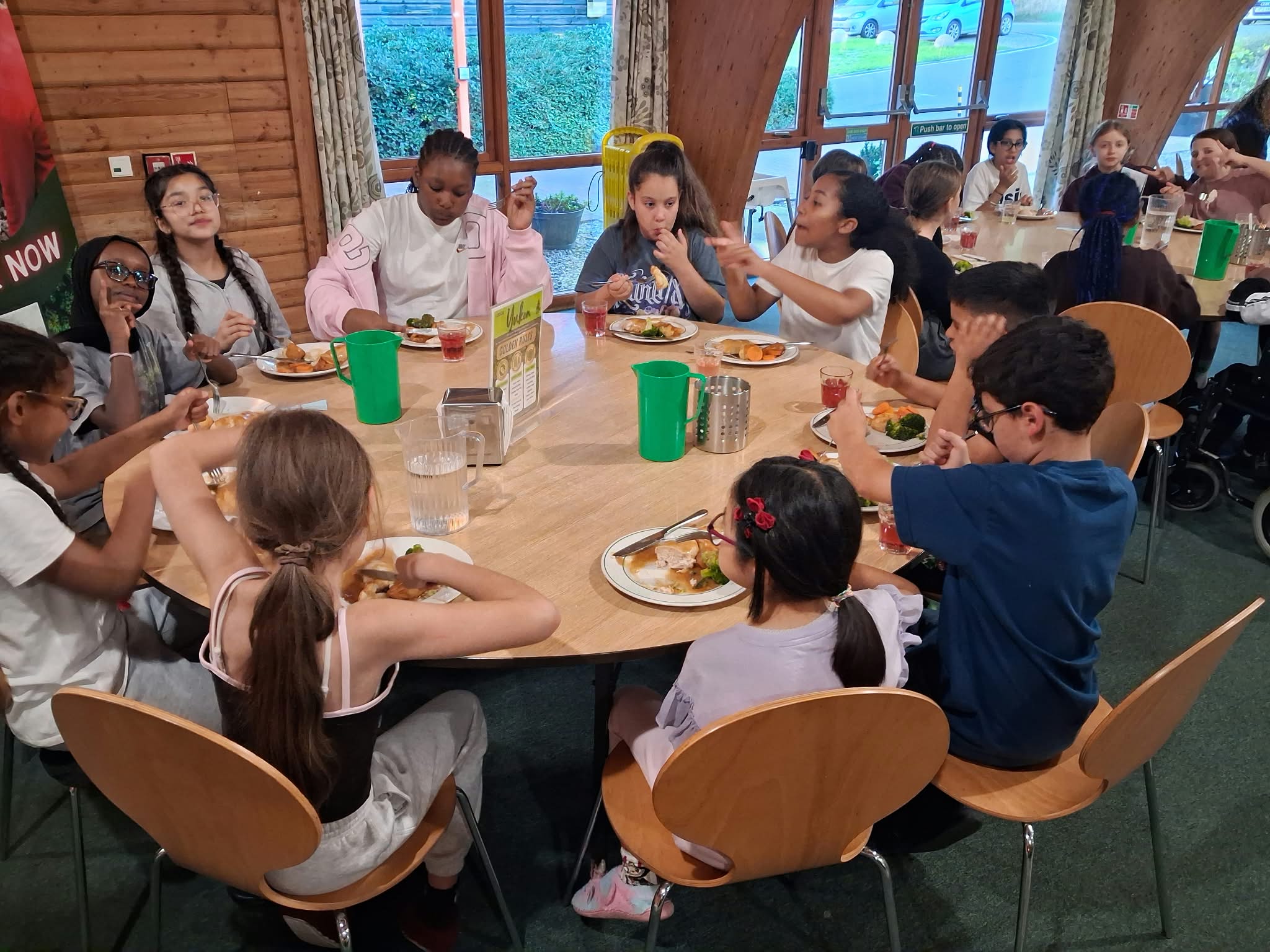 Year 5 & 6 children enjoying their dinner