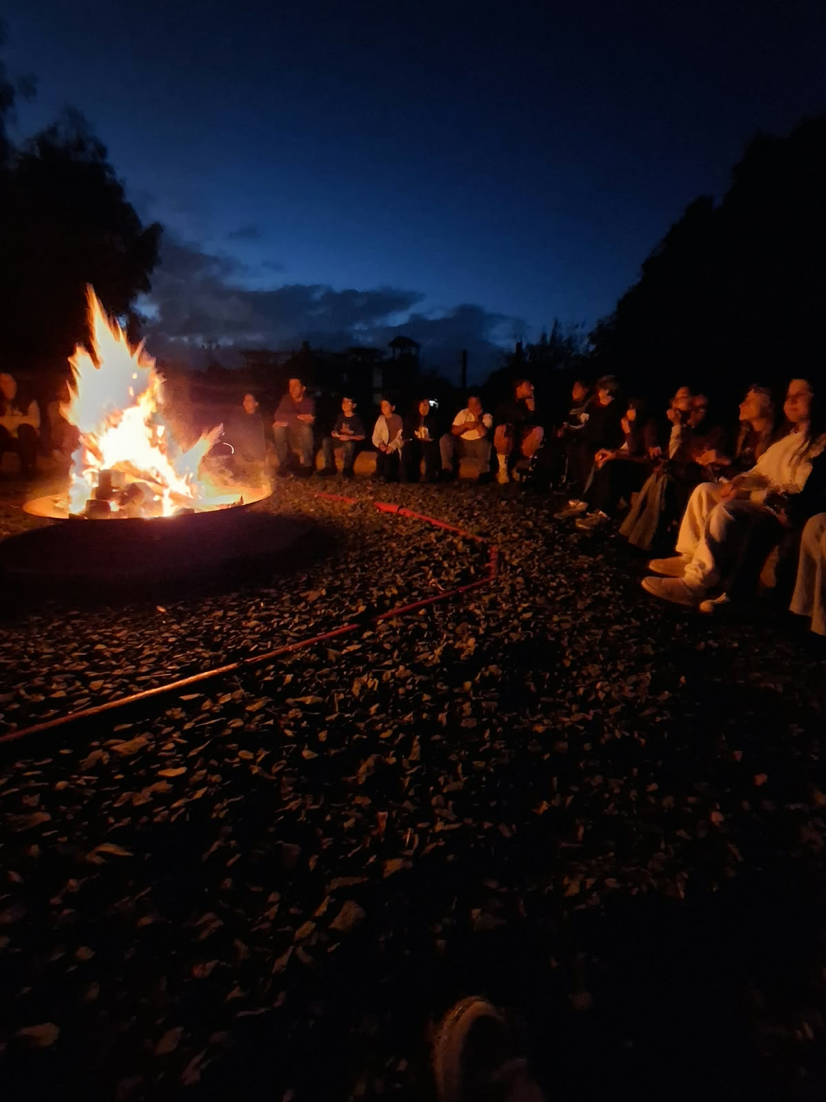 Year 5 & 6 children around a campfire