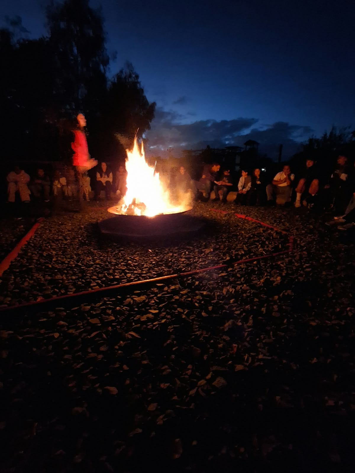 Year 5 & 6 children around a campfire
