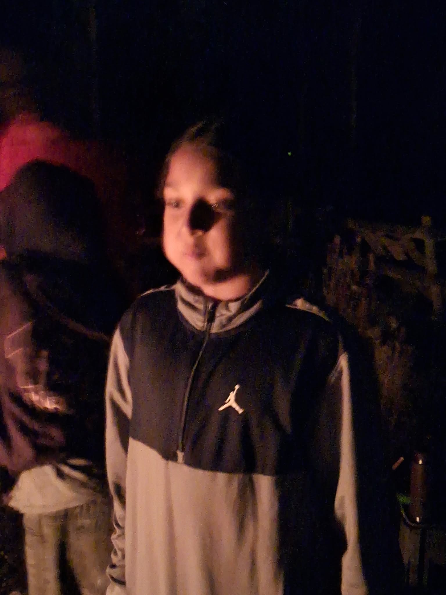Year 5 & 6 children around a campfire
