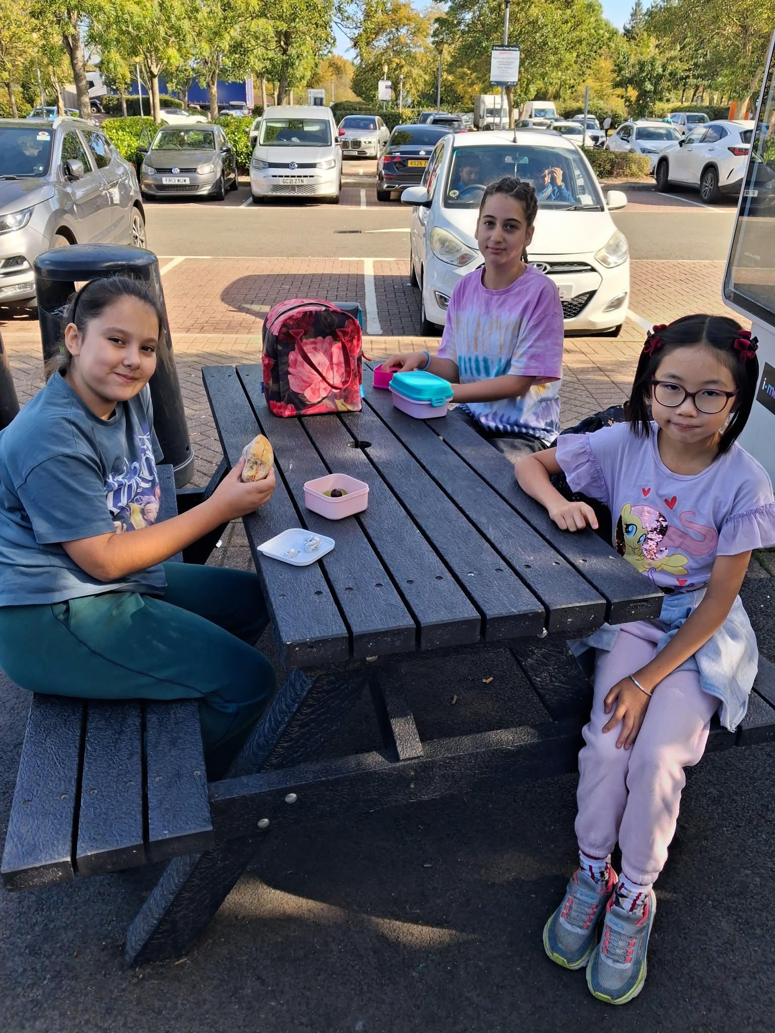 Year 5 & 6 children sat around a table eating lunch