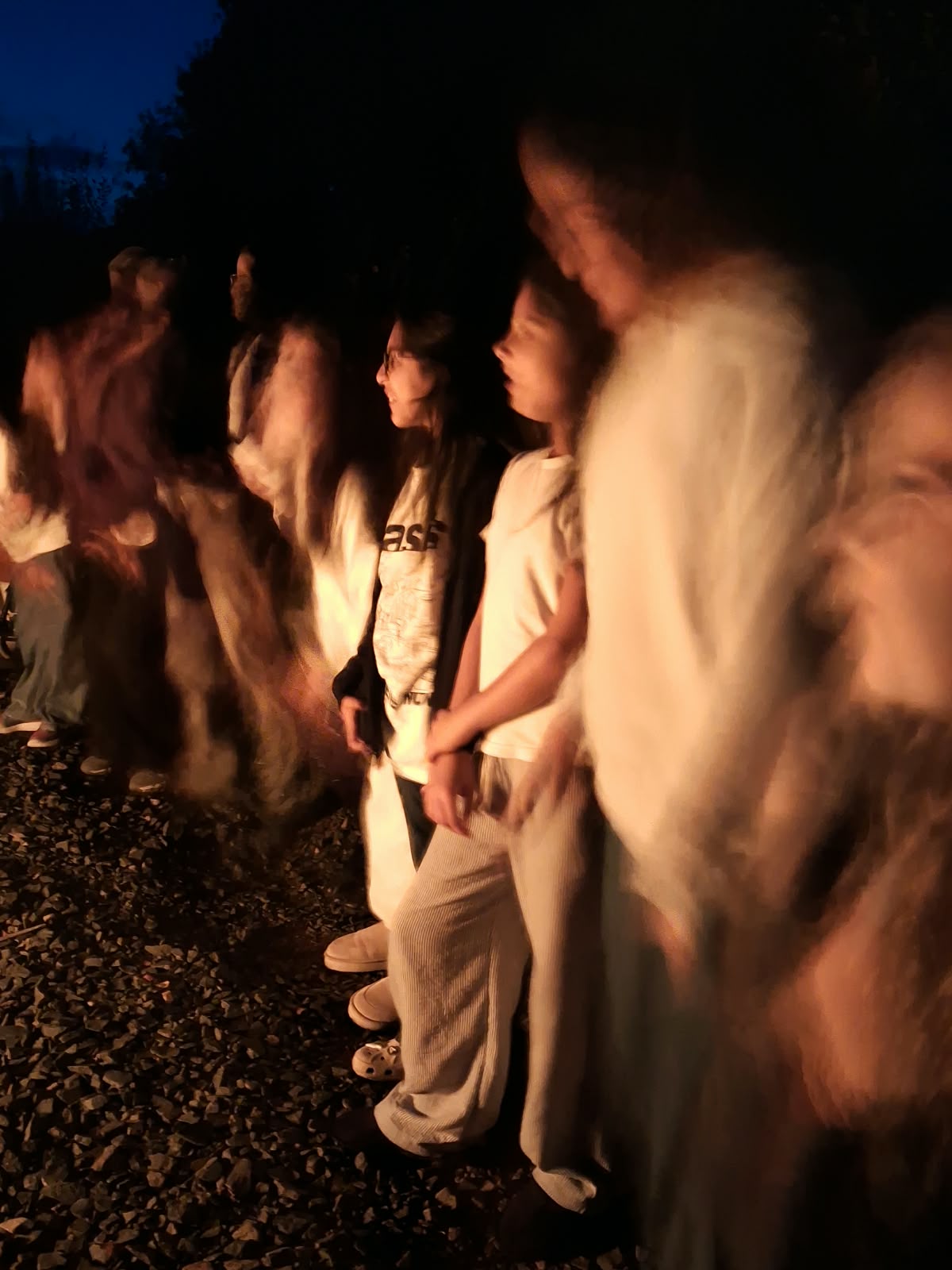 Year 5 & 6 children around a campfire