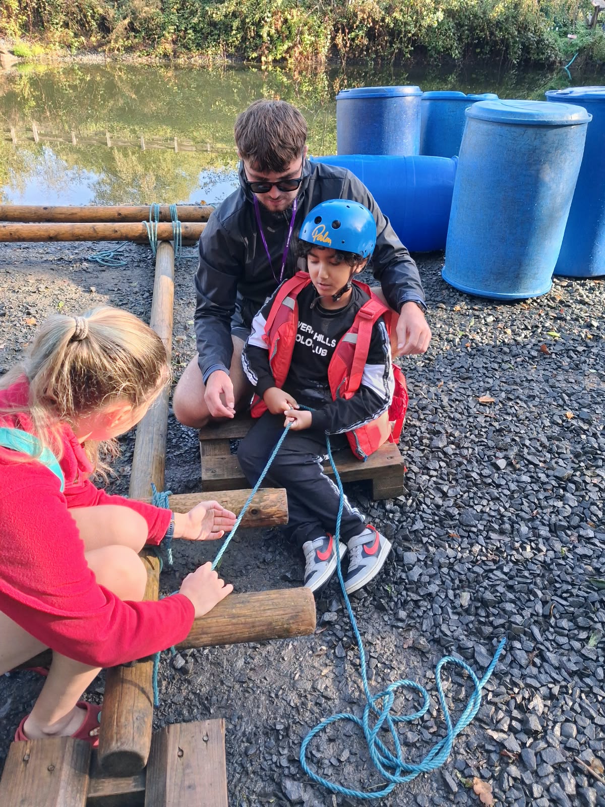 Year 5 & 6 children building and testing rafts