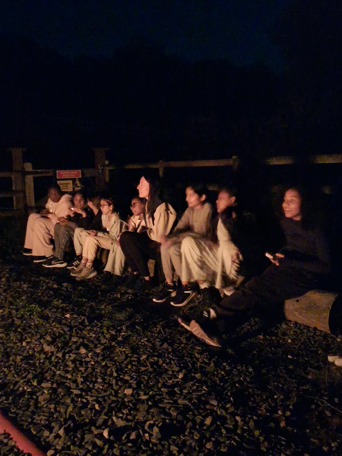 Year 5 & 6 children around a campfire