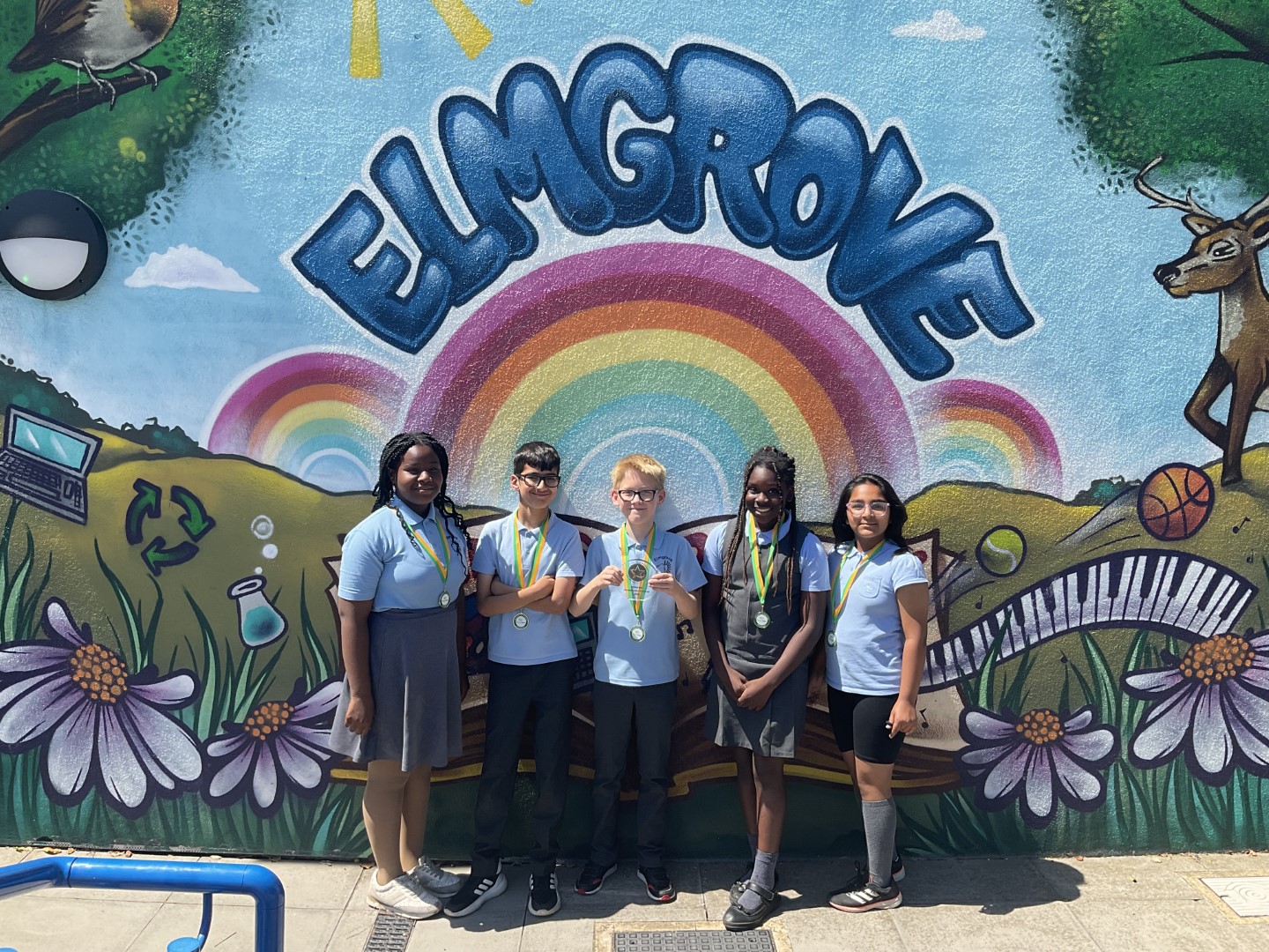 Smiles for the camera holding the trophy back at school.